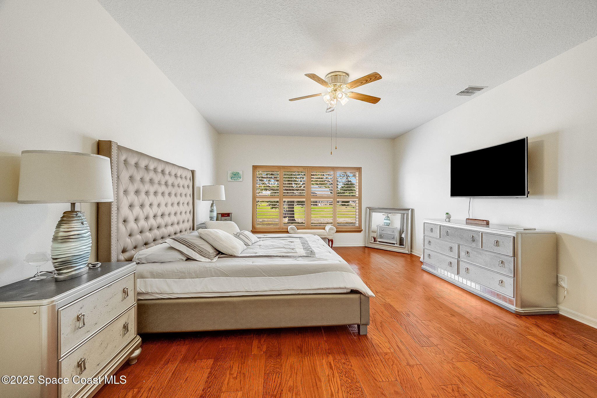 1137 Morgan Circle Northeast Palm Bay, FL 32905 - Photo 3 of 64 a living room with furniture and a flat screen tv