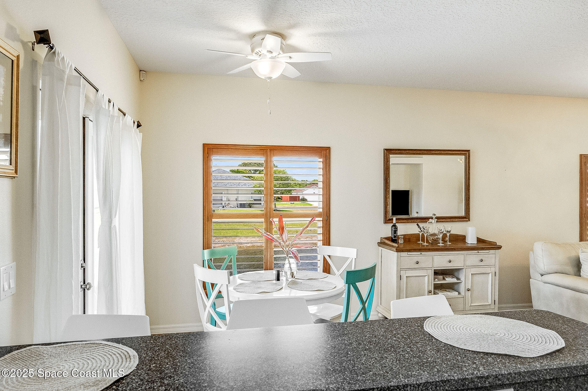 1137 Morgan Circle Northeast Palm Bay, FL 32905 - Photo 32 of 64 a living room with furniture and a large window