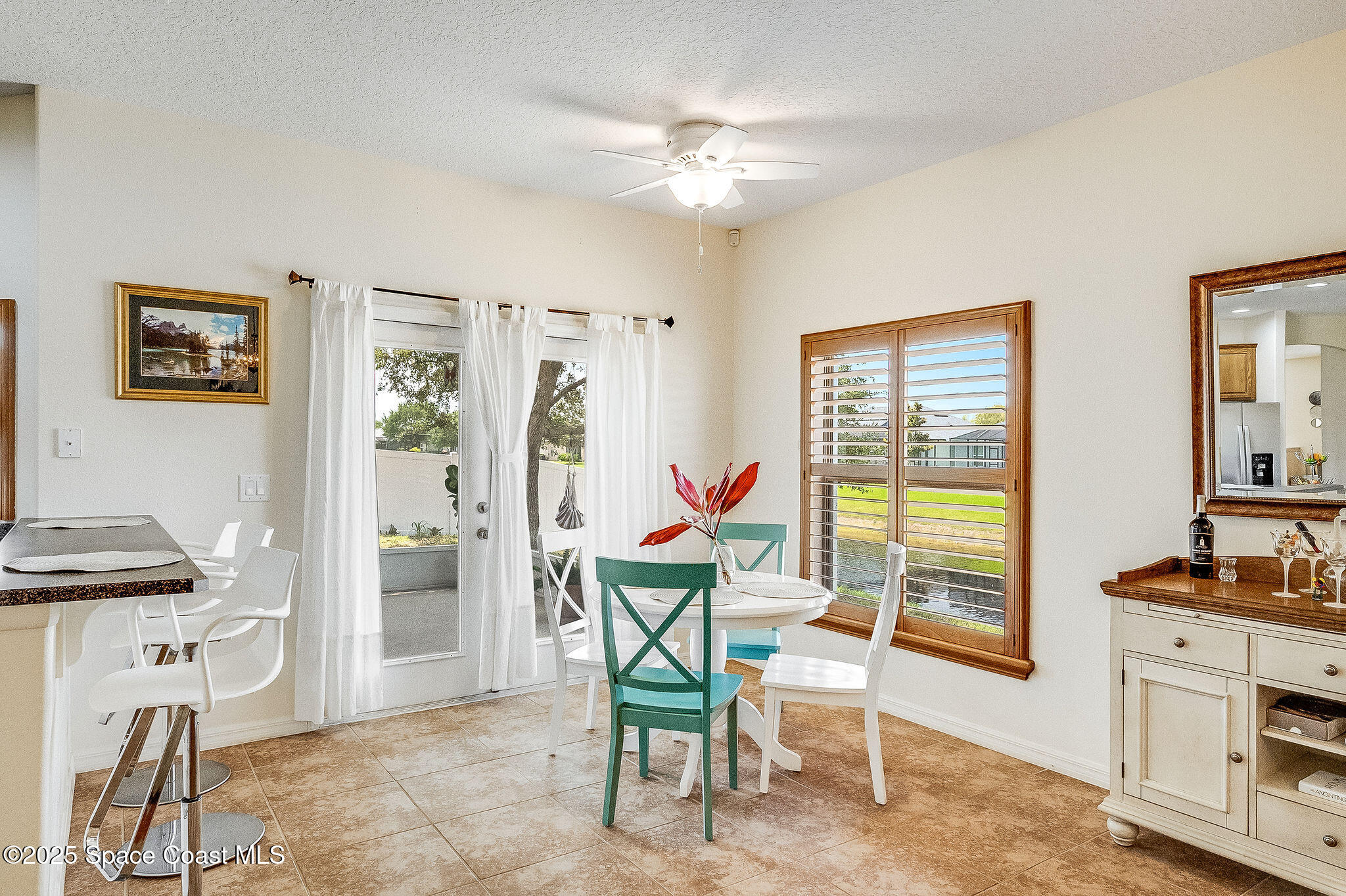 1137 Morgan Circle Northeast Palm Bay, FL 32905 - Photo 34 of 64 a view of a livingroom with furniture and a flat screen tv