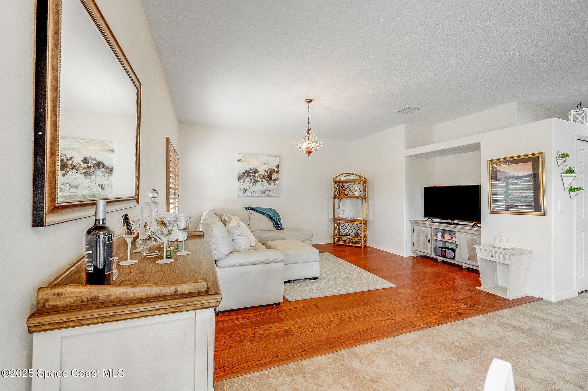 1137 Morgan Circle Northeast Palm Bay, FL 32905 - Photo 37 of 64 a living room with furniture and a flat screen tv
