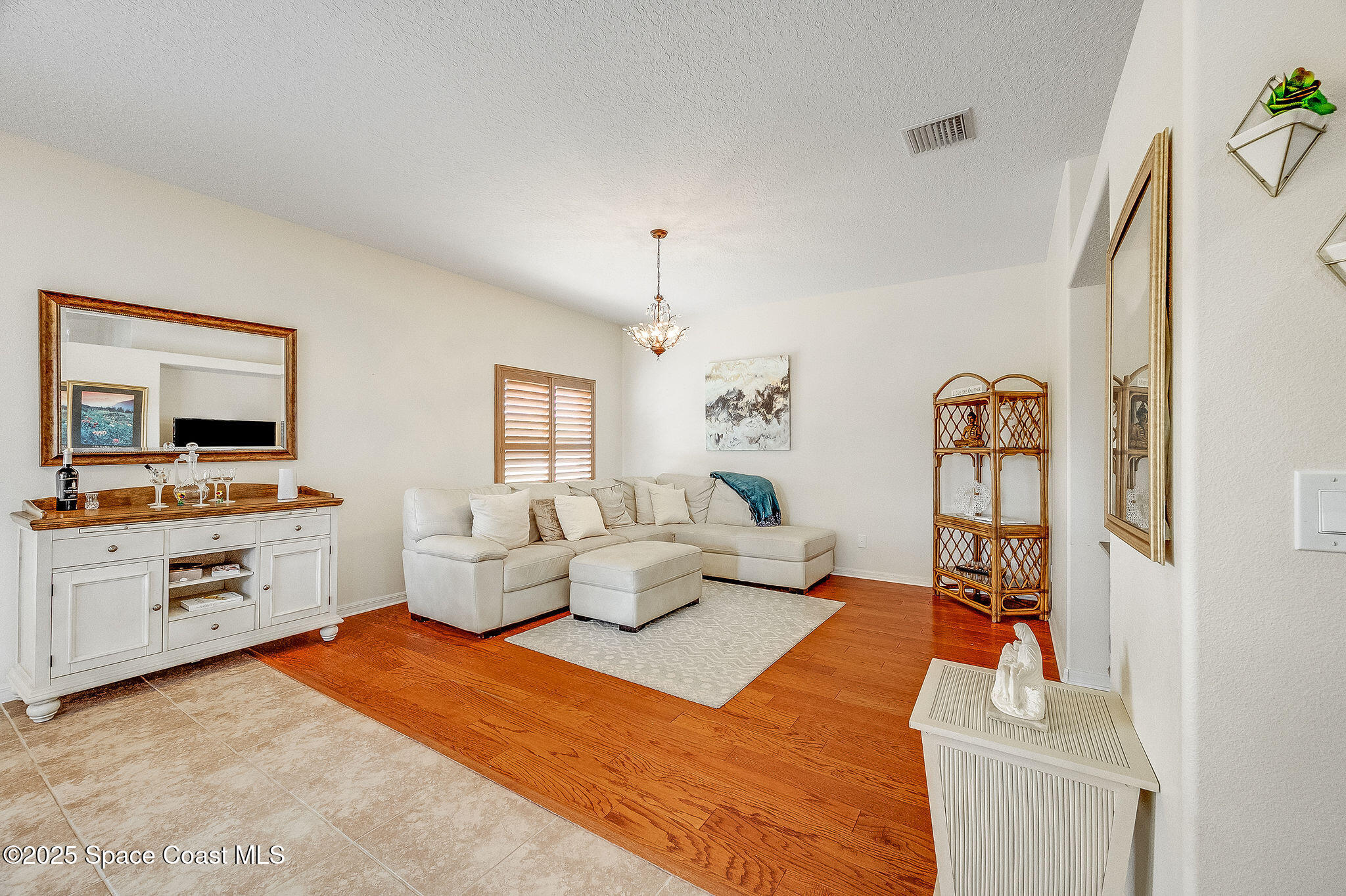 1137 Morgan Circle Northeast Palm Bay, FL 32905 - Photo 38 of 64 a bedroom with furniture and a flat screen tv