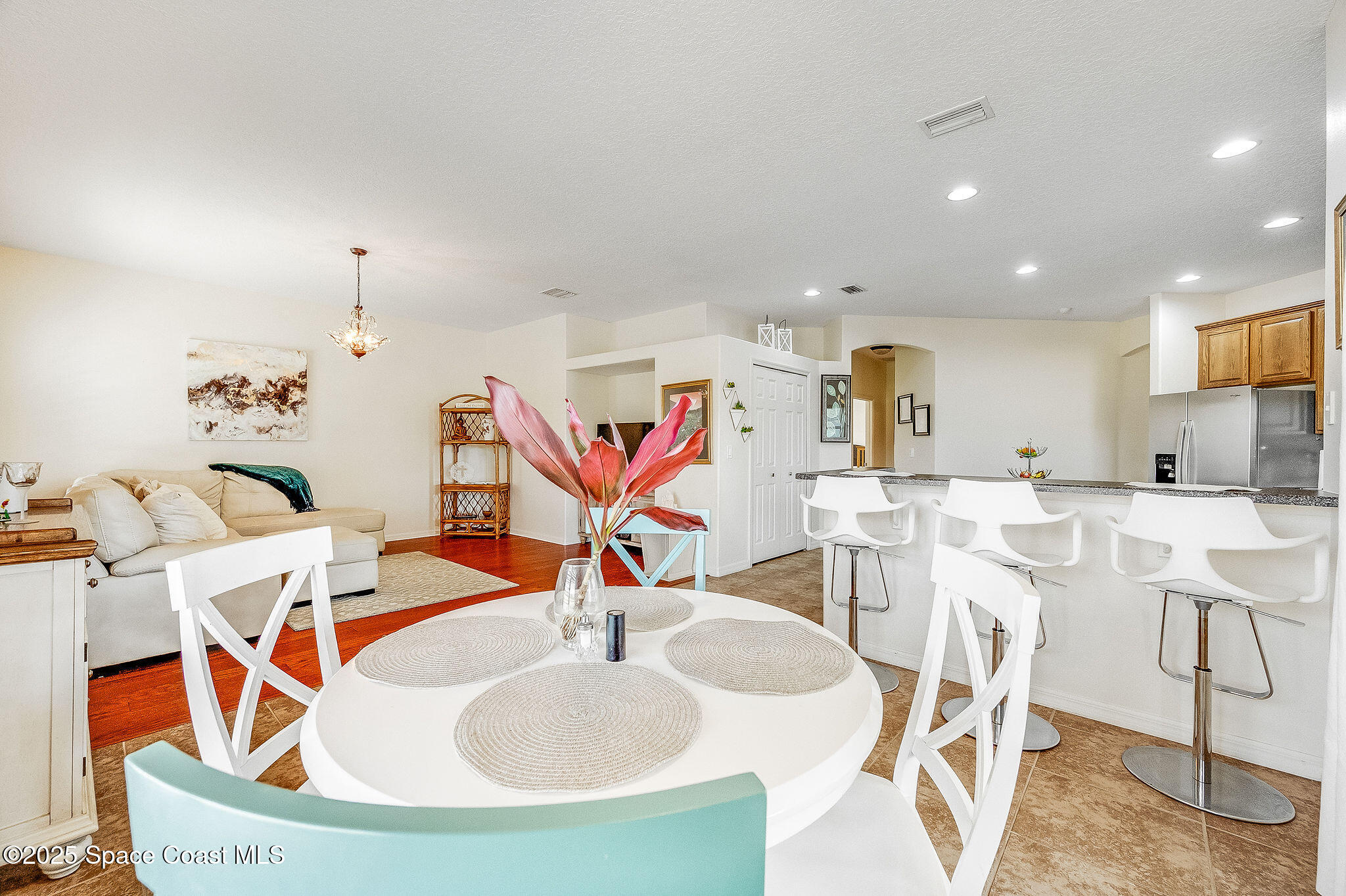 1137 Morgan Circle Northeast Palm Bay, FL 32905 - Photo 39 of 64 a dining room with furniture and wooden floor