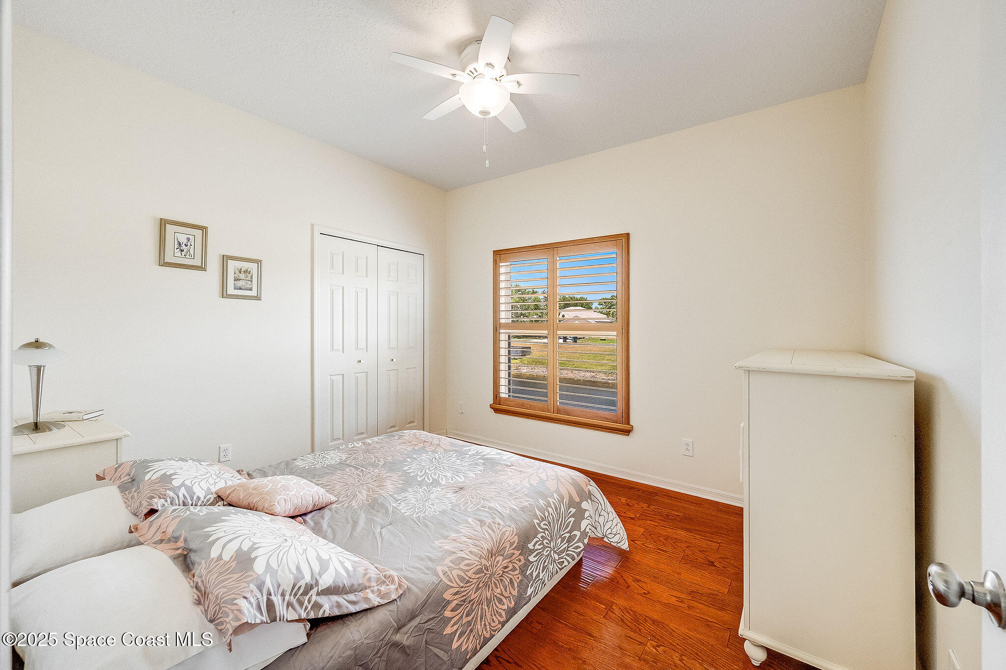 1137 Morgan Circle Northeast Palm Bay, FL 32905 - Photo 43 of 64 a bedroom with a bed and a window