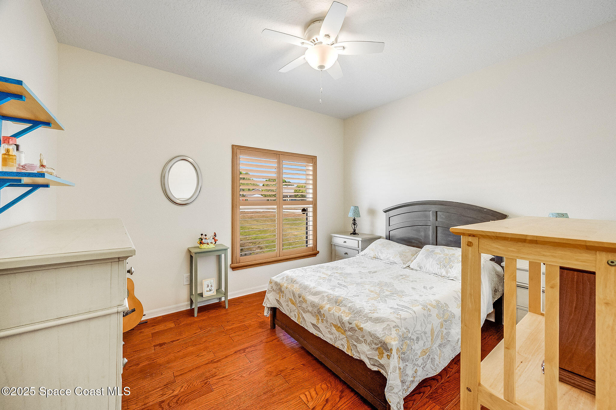 1137 Morgan Circle Northeast Palm Bay, FL 32905 - Photo 46 of 64 a bedroom with a bed and a window