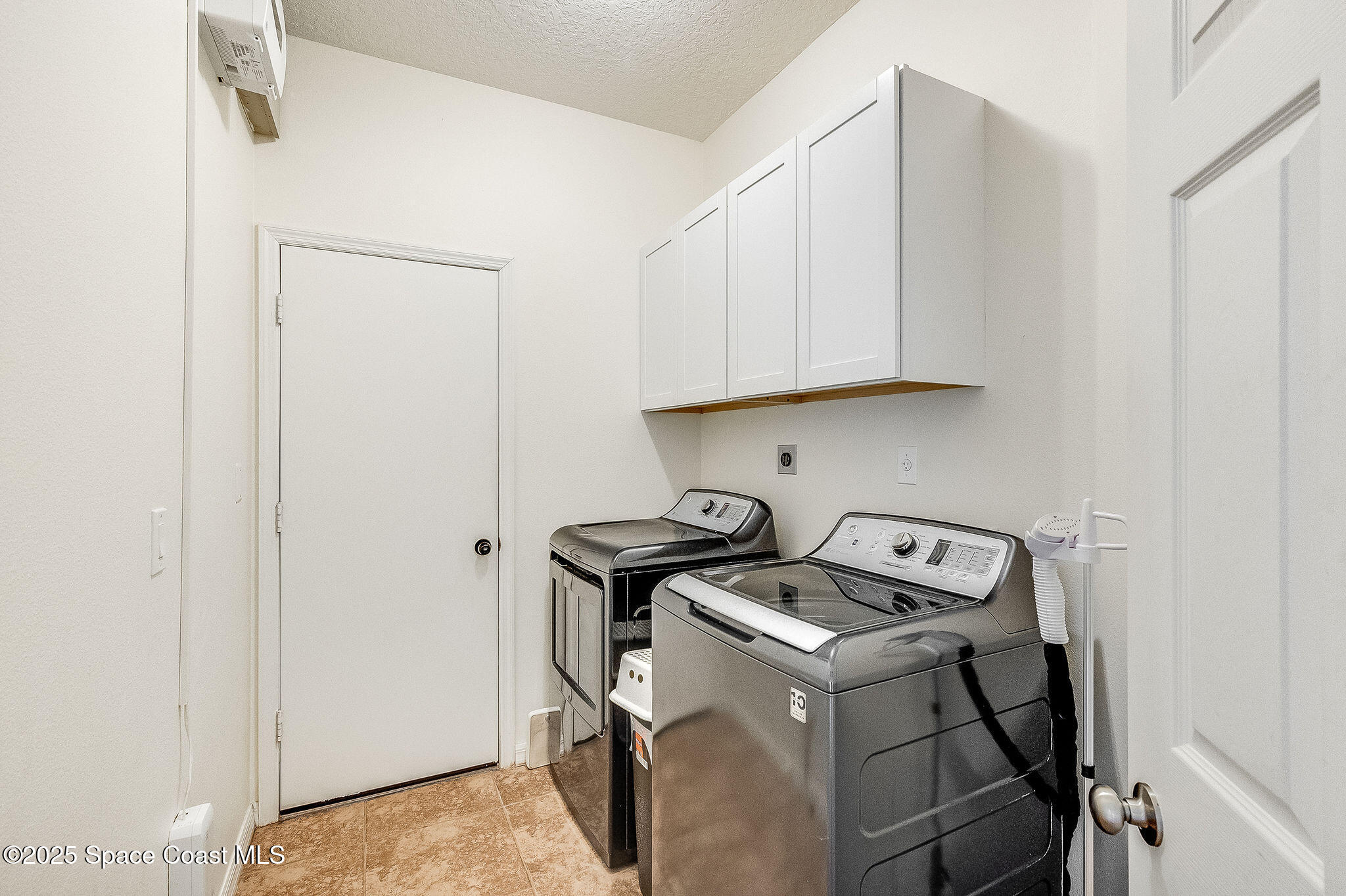 1137 Morgan Circle Northeast Palm Bay, FL 32905 - Photo 47 of 64 Laundry Room