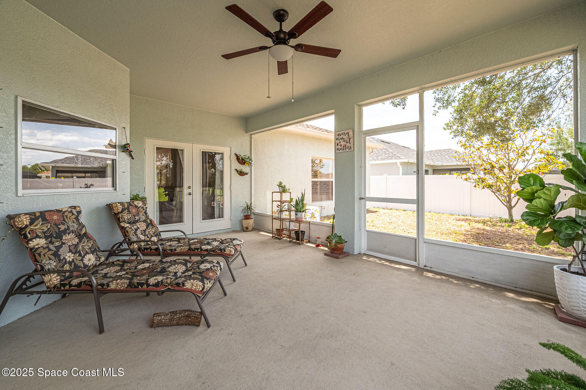 1137 Morgan Circle Northeast Palm Bay, FL 32905 - Photo 49 of 64 a living room with furniture and a large window with outer view