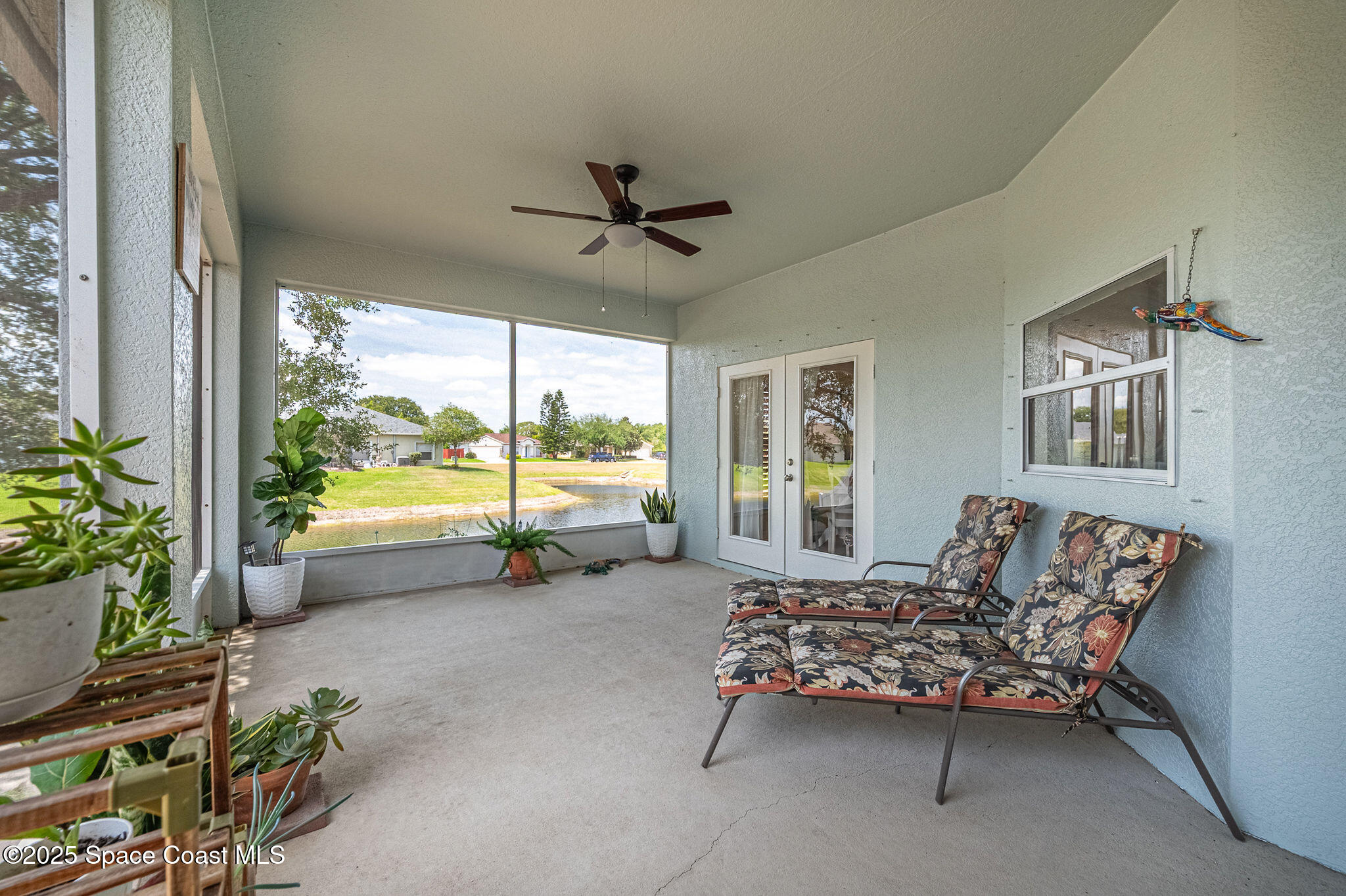 1137 Morgan Circle Northeast Palm Bay, FL 32905 - Photo 51 of 64 a bedroom with furniture and a large window