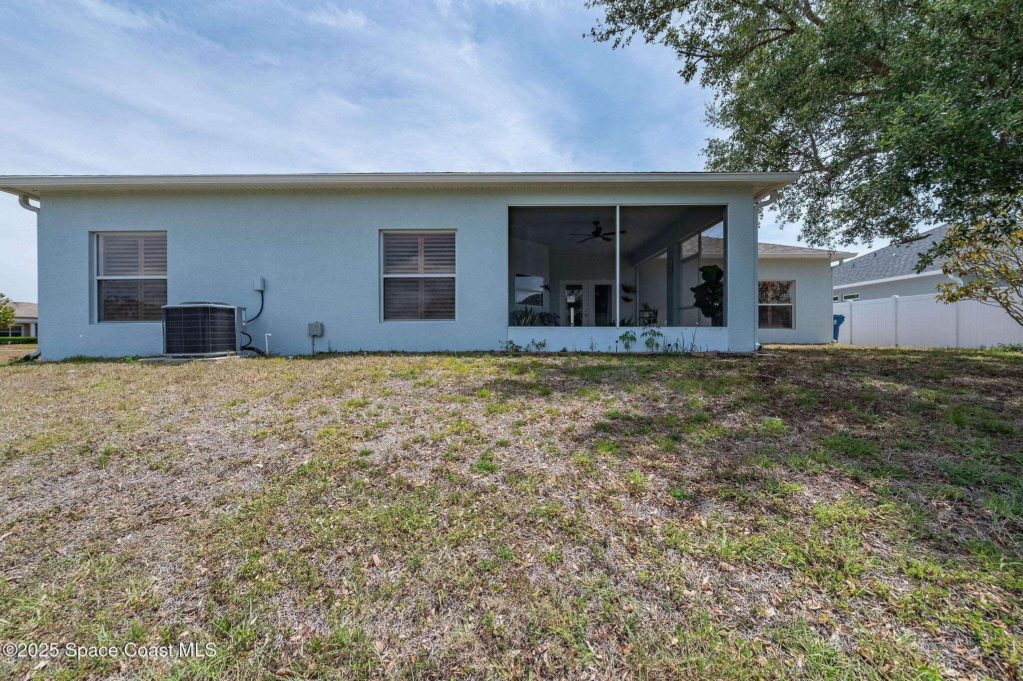 1137 Morgan Circle Northeast Palm Bay, FL 32905 - Photo 58 of 64 a view of a house with yard and porch