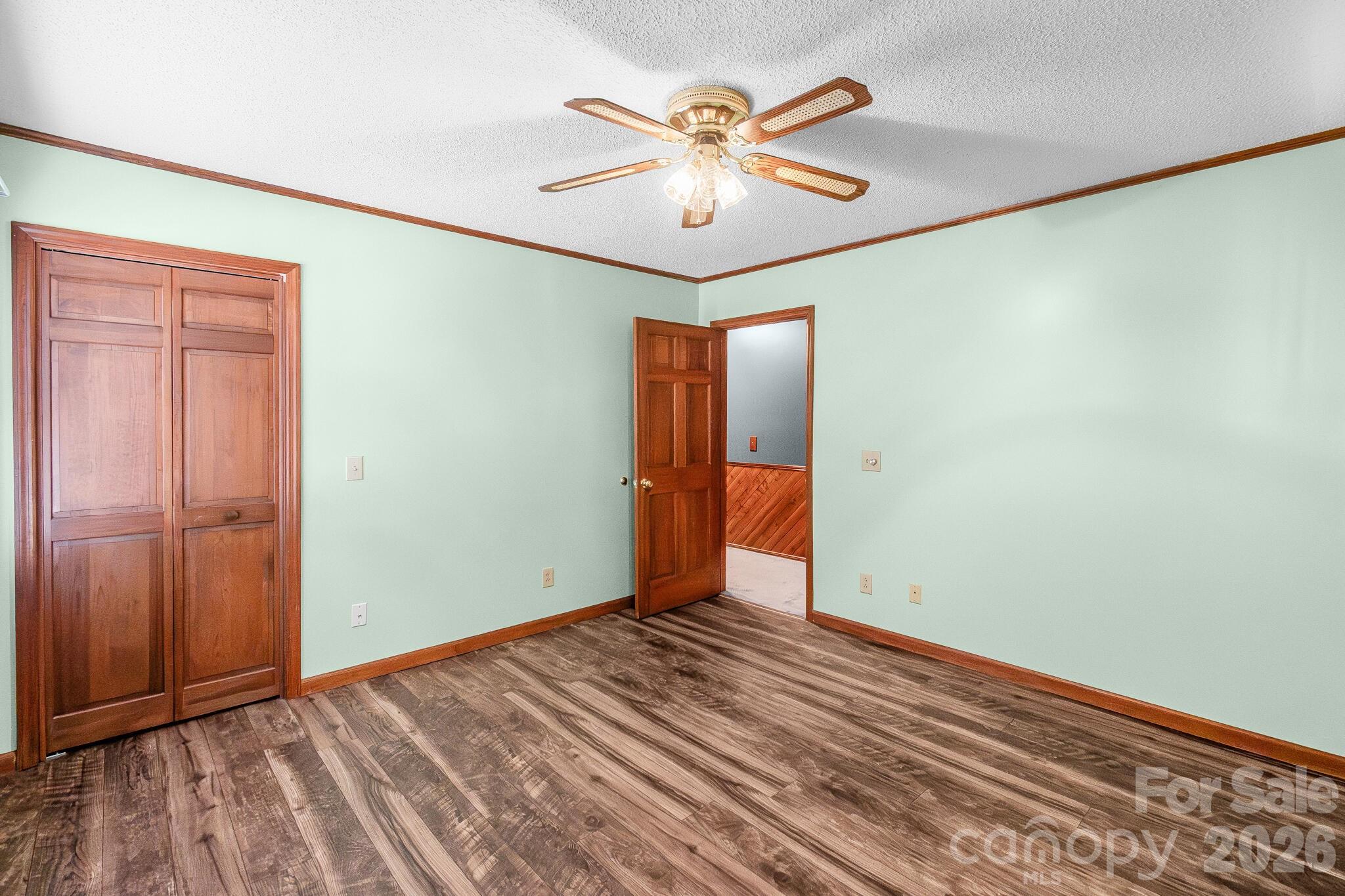 1295 Cattle Ridge Road Cheraw, SC 29520 - Photo 19 of 21 wooden floor in an empty room with a window