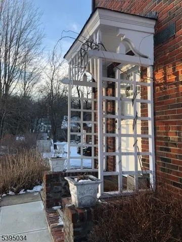 a front view of a building with a garden