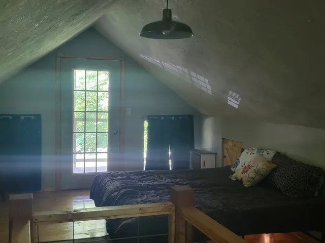 a kitchen with counter top space and living room