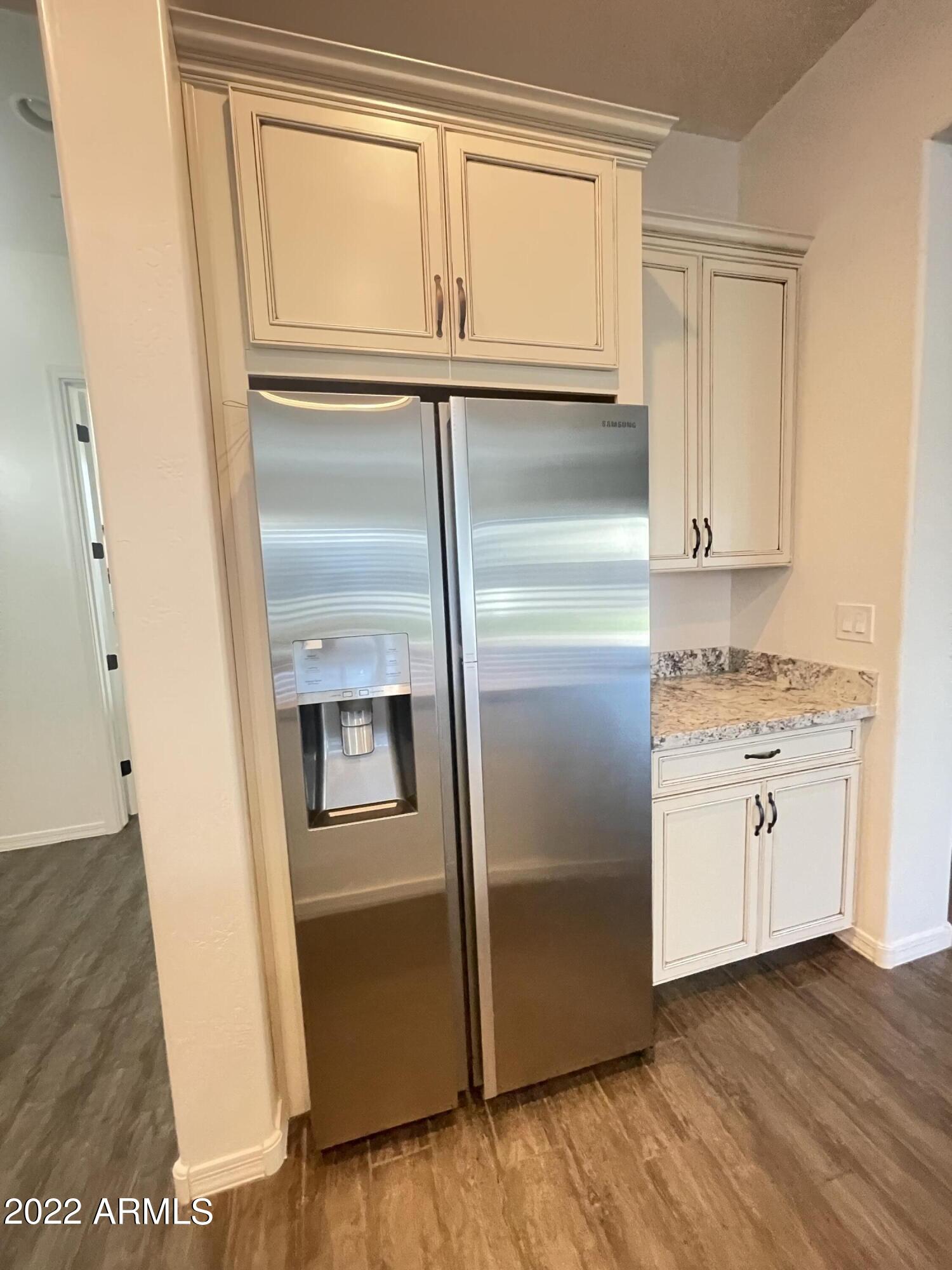 991 East Hampton Lane Gilbert, AZ 85295 - Photo 11 of 13 a kitchen with granite countertop stainless steel appliances a refrigerator and cabinets