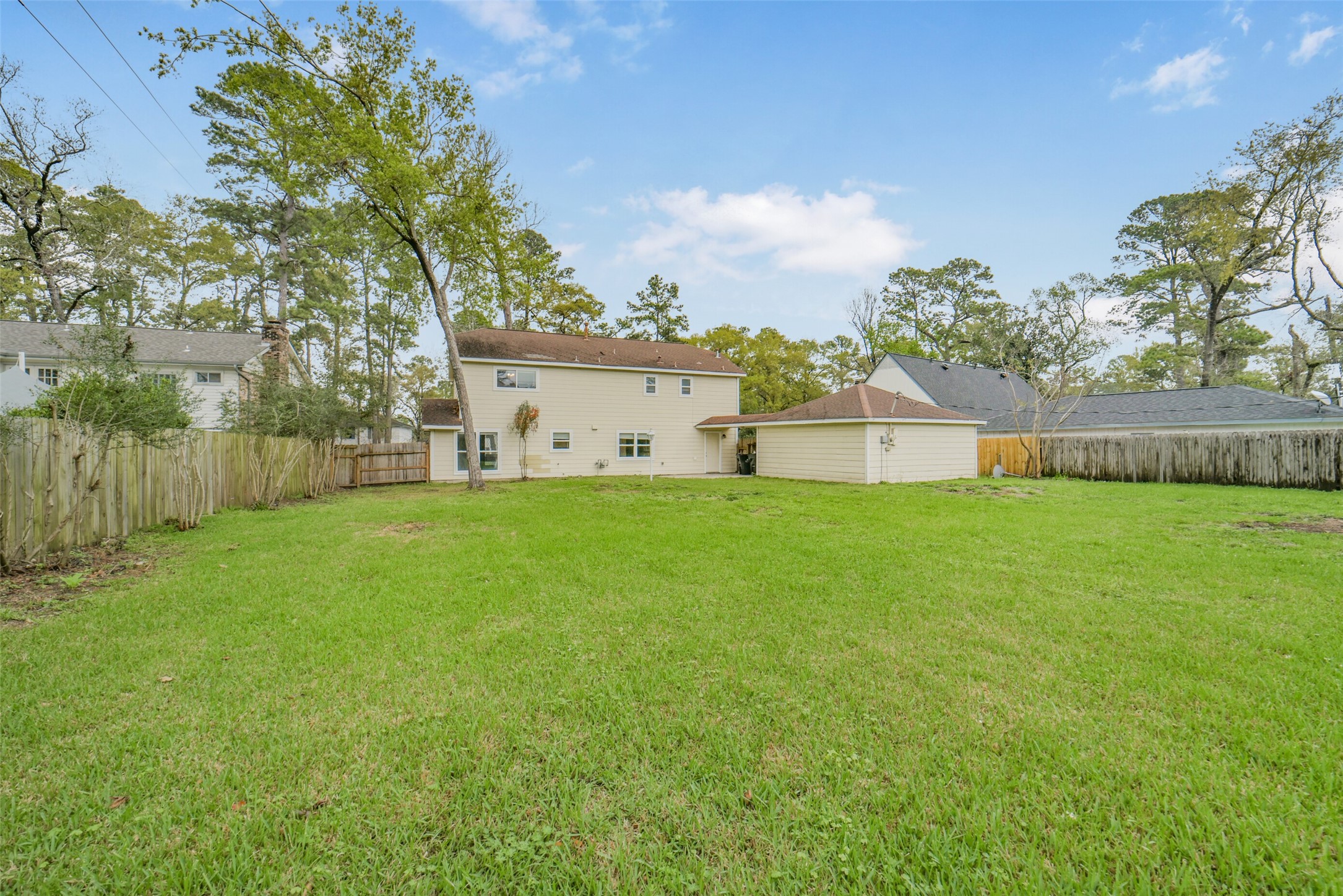7611 Theisswood Road Spring, TX 77379 - Photo 34 of 41 a house view with swimming pool in front of it