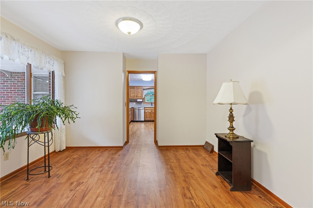 16295 Sperry Road Vermilion, OH 44089 - Photo 6 of 48 Hall with hardwood / wood-style floors
