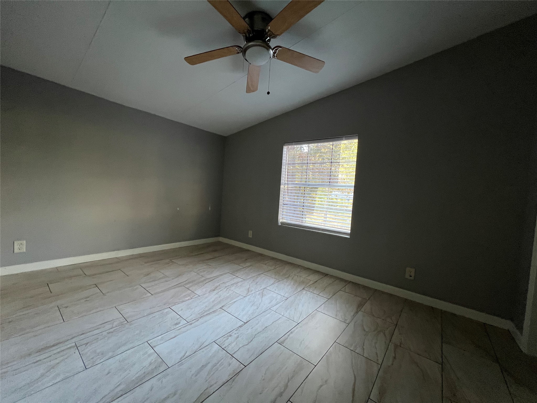 66 McFaddin Road Huntsville, TX 77340 - Photo 12 of 22 an empty room with a empty space and a ceiling fan