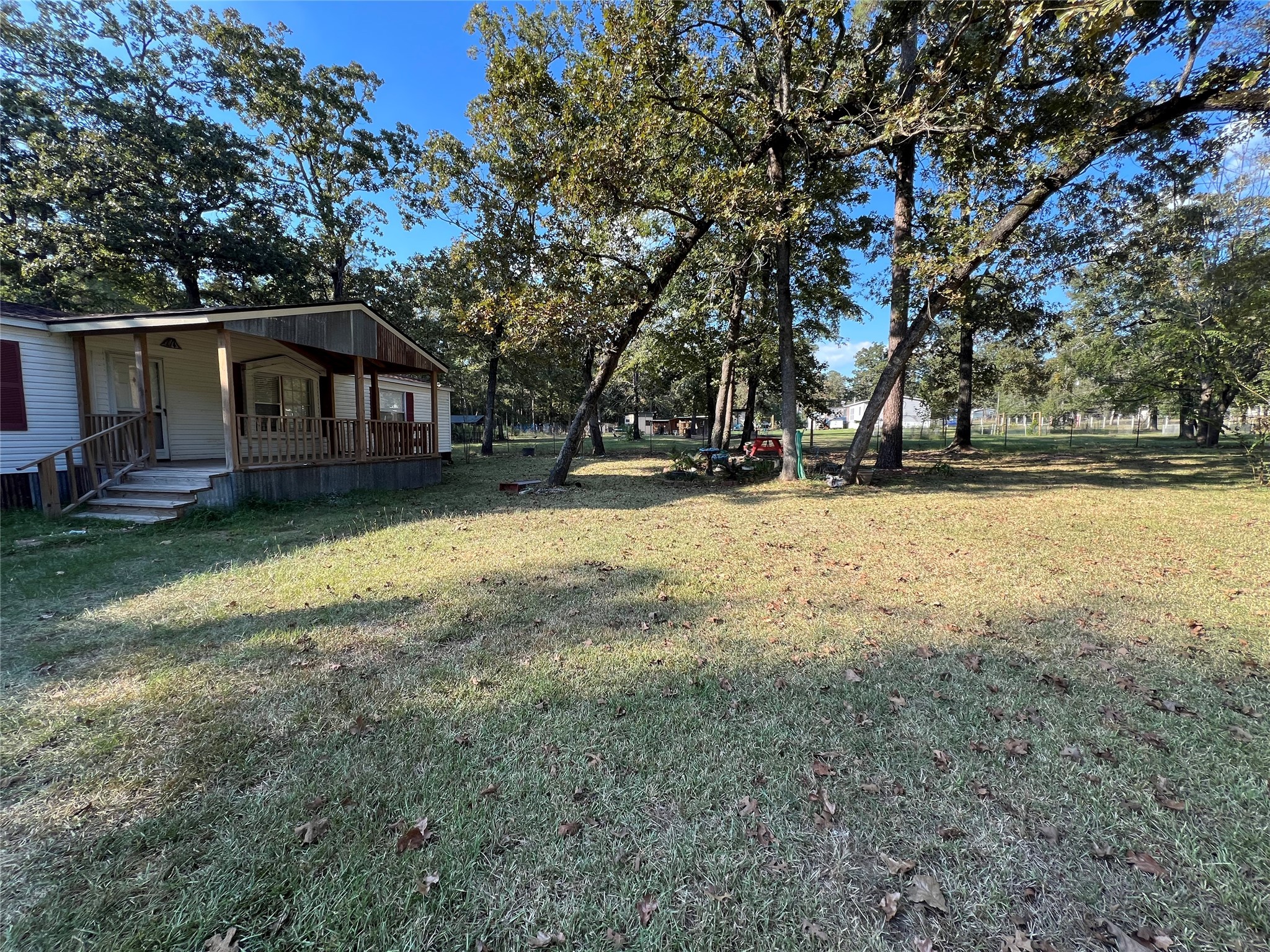 66 McFaddin Road Huntsville, TX 77340 - Photo 15 of 22 a view of a yard with a house in the background