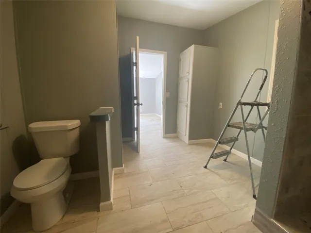 a bathroom with a shower sink and mirror