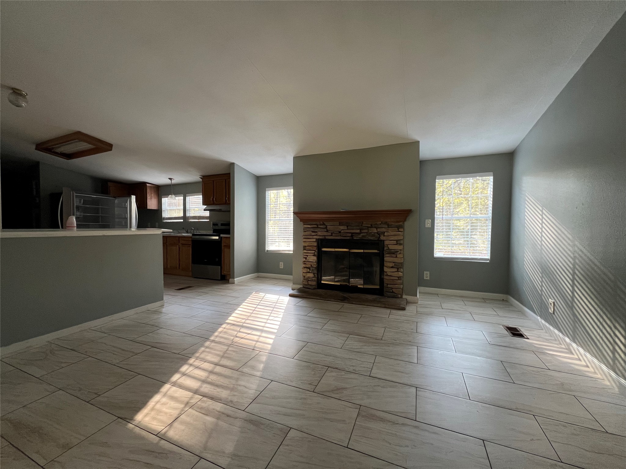66 McFaddin Road Huntsville, TX 77340 - Photo 3 of 22 a view of a livingroom with a fireplace and window