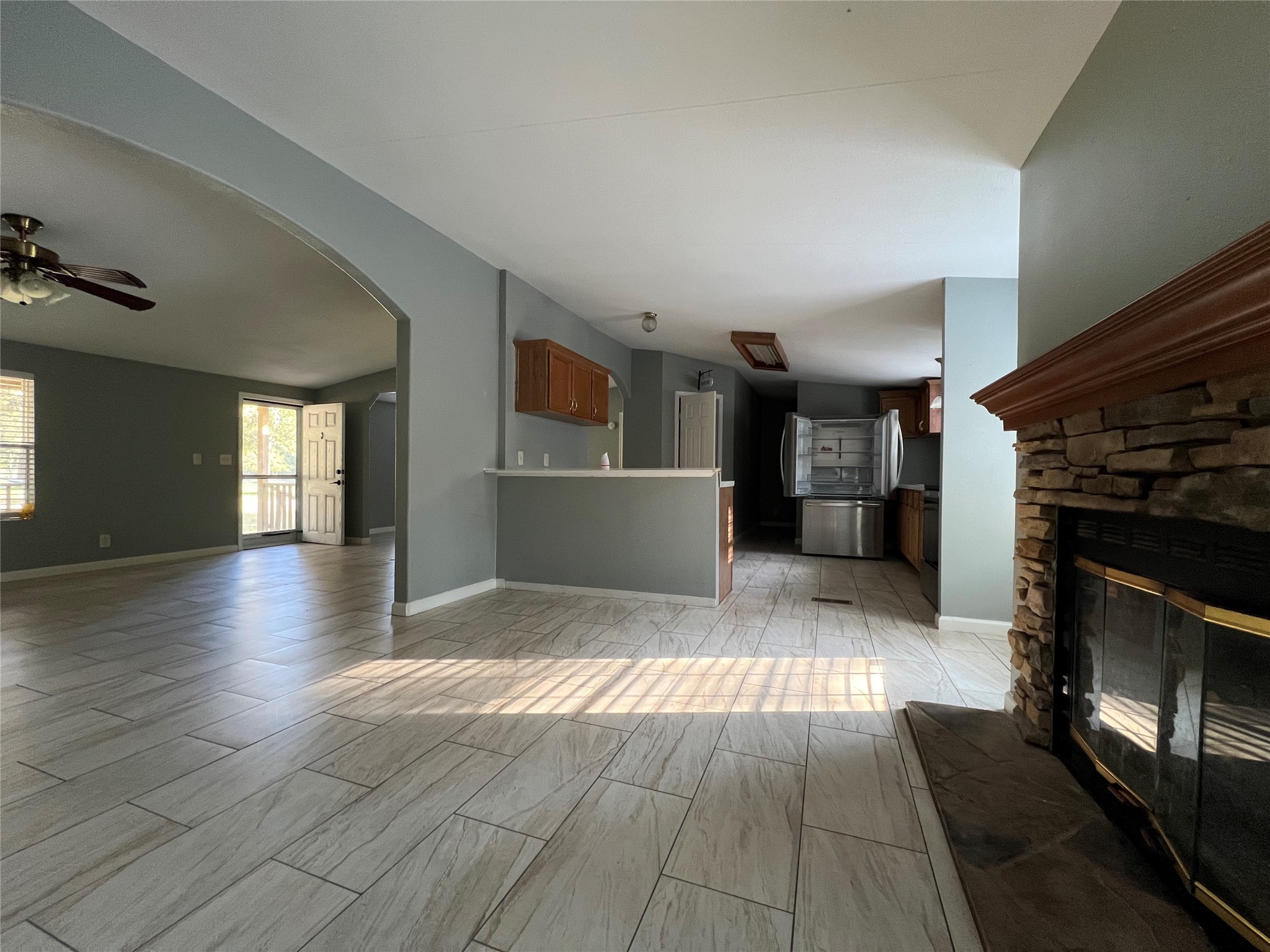 66 McFaddin Road Huntsville, TX 77340 - Photo 5 of 22 a view of a living room a hallway with wooden floor and a fireplace