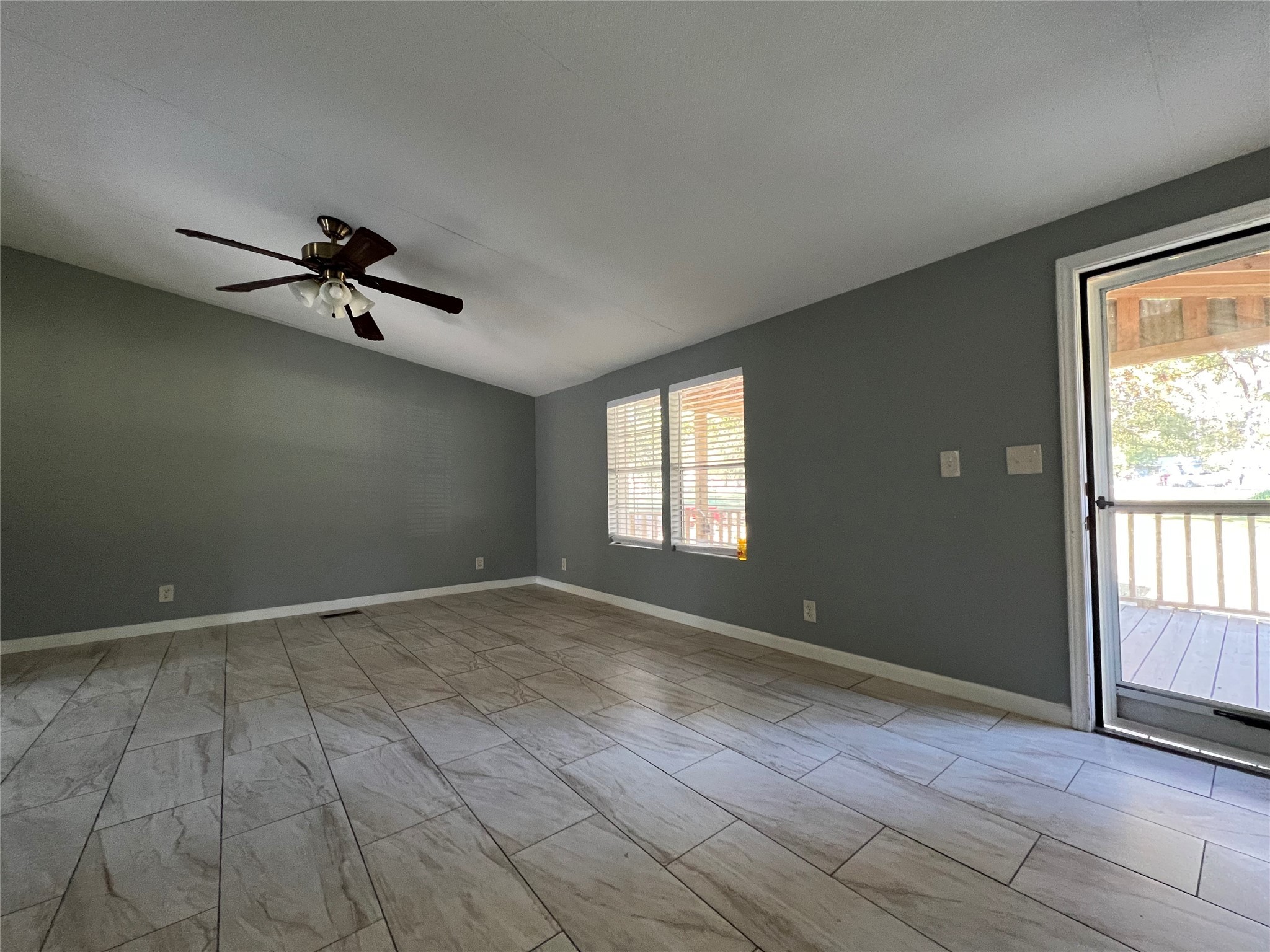 66 McFaddin Road Huntsville, TX 77340 - Photo 7 of 22 wooden floor in an empty room with a window
