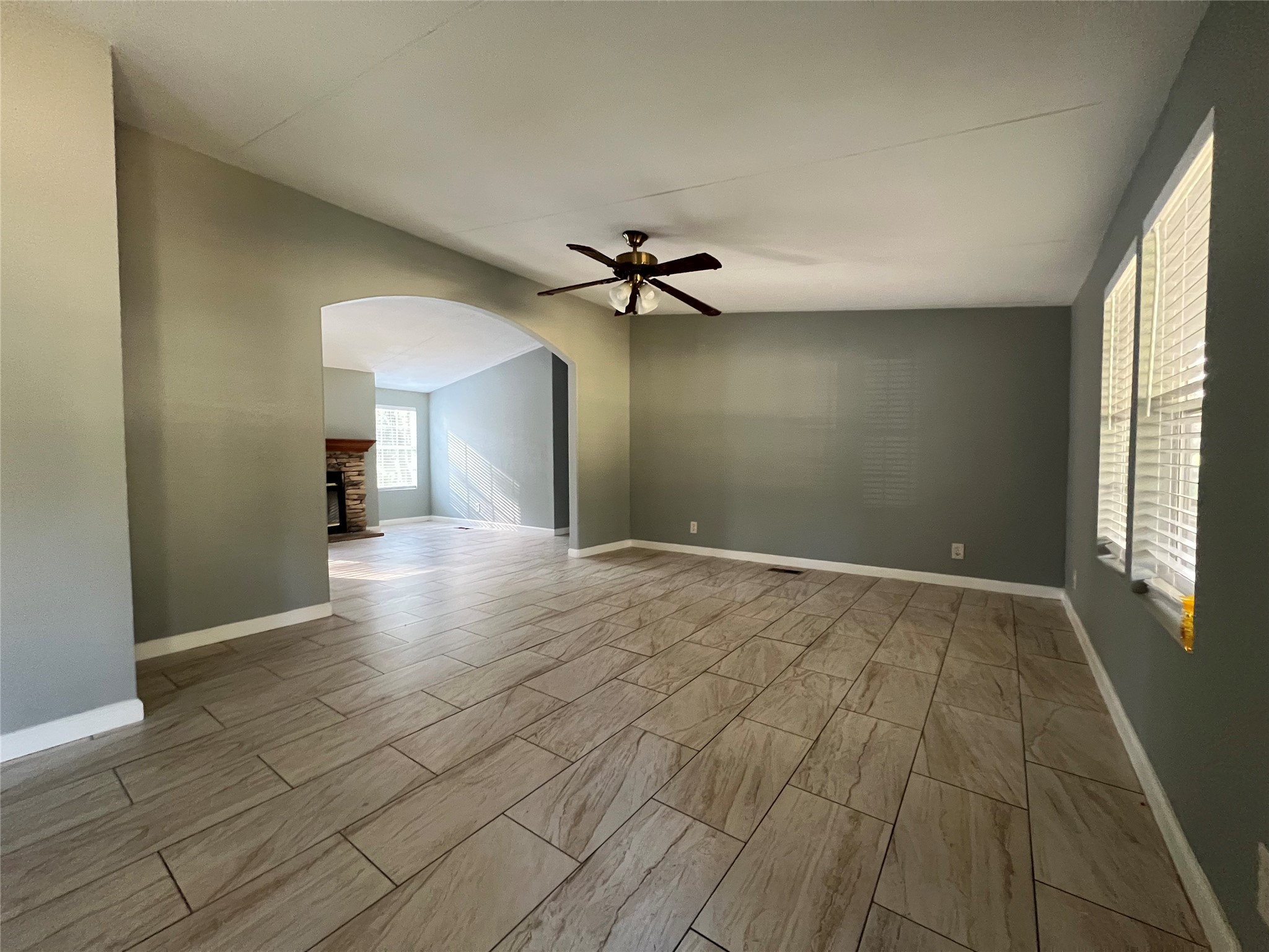 66 McFaddin Road Huntsville, TX 77340 - Photo 8 of 22 wooden floor in an empty room with a window