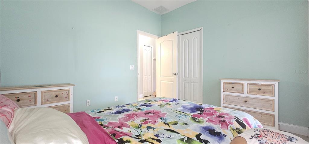 10927 Leader Lane Orlando, FL 32825 - Photo 20 of 29 a bedroom with a bed and a window