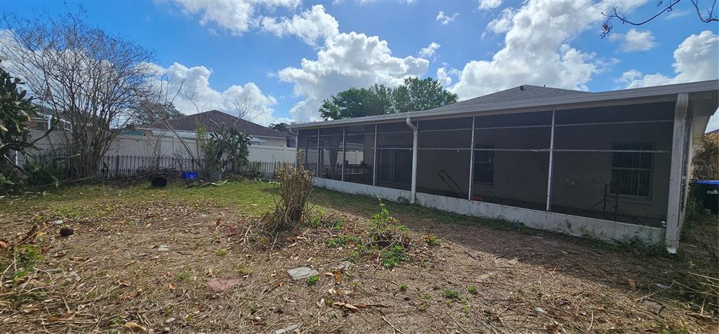 10927 Leader Lane Orlando, FL 32825 - Photo 25 of 29 a view of a backyard with a small cabin