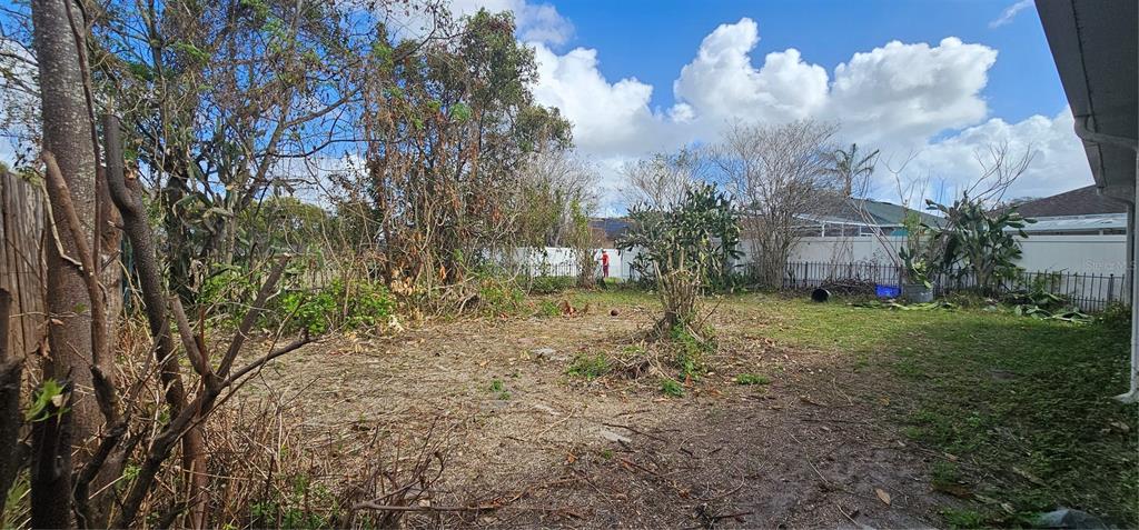 10927 Leader Lane Orlando, FL 32825 - Photo 28 of 29 a view of a house with a yard