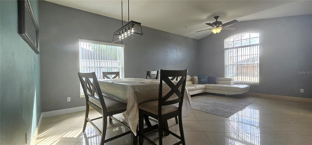 10927 Leader Lane Orlando, FL 32825 - Photo 6 of 29 a view of a dining room with furniture and window