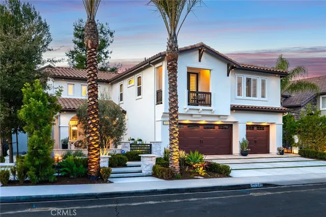 a view of front of a house with a fountain