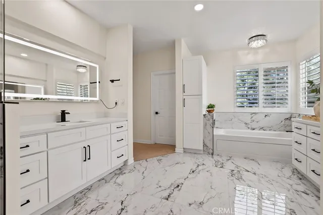 a view of a kitchen with stainless steel appliances granite countertop a stove top oven