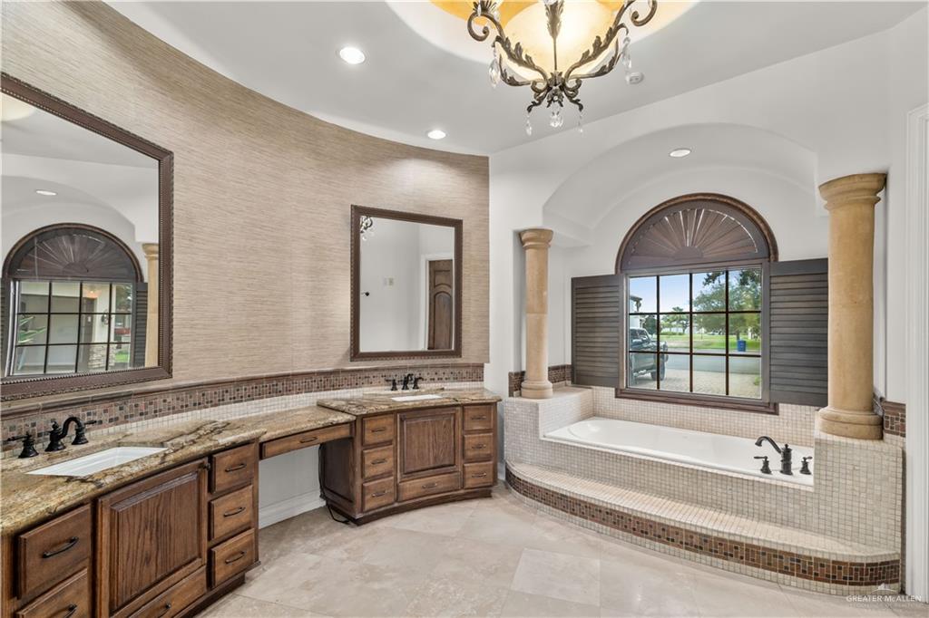 4405 South "H" Street McAllen, TX 78503 - Photo 13 of 33 a spacious bathroom with a large tub sink and mirror