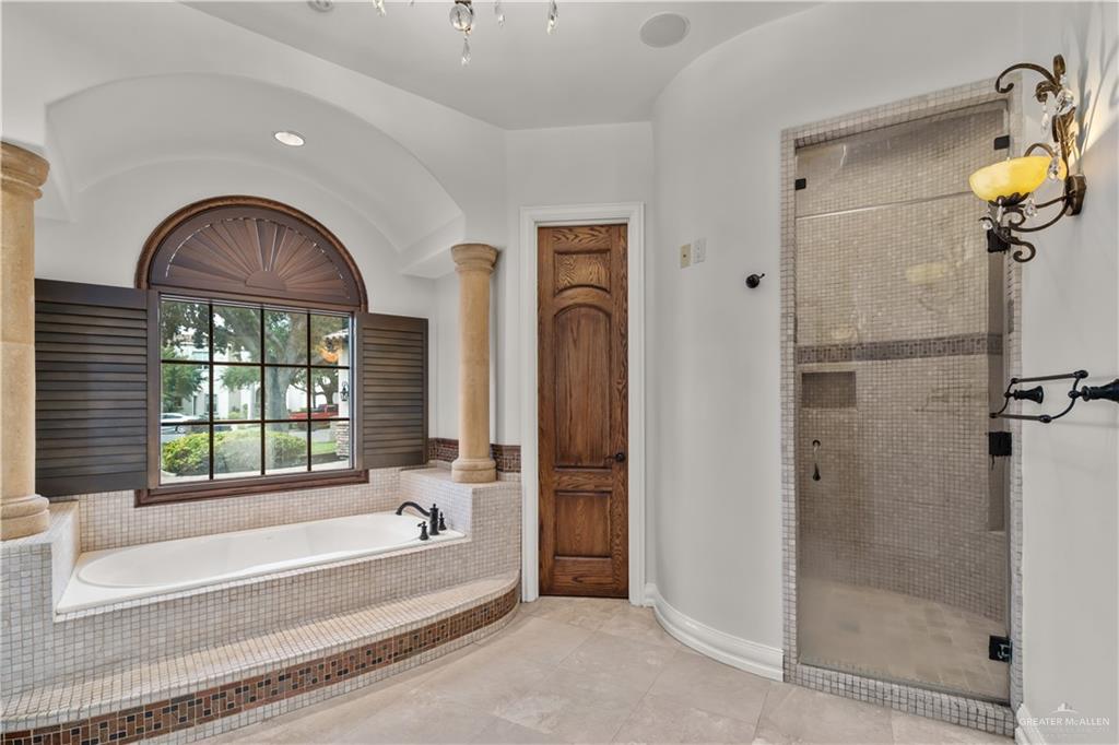 4405 South "H" Street McAllen, TX 78503 - Photo 14 of 33 a bathroom with a bathtub and a shower