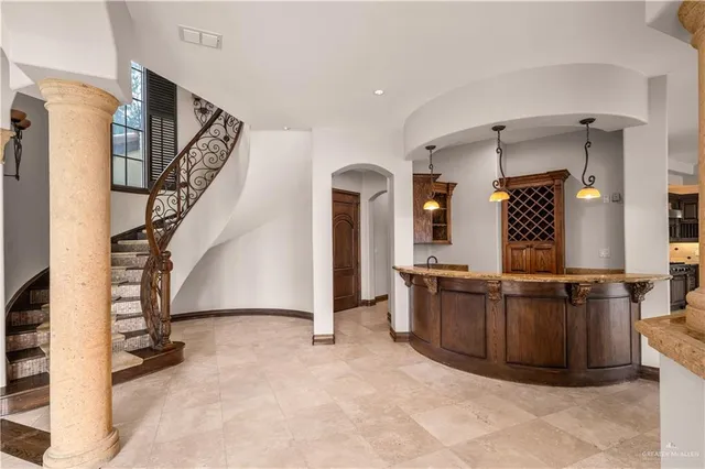 a view of a kitchen with furniture and staircase