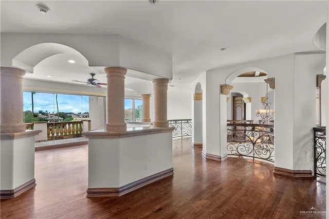 a kitchen with stainless steel appliances granite countertop a stove and cabinets with wooden floor