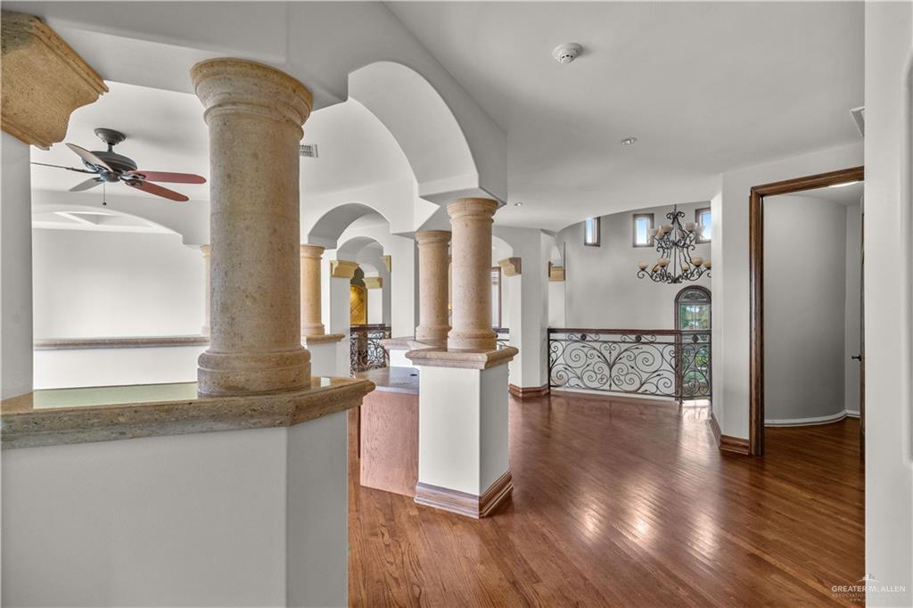 4405 South "H" Street McAllen, TX 78503 - Photo 22 of 33 a living room with couches and kitchen view with wooden floor
