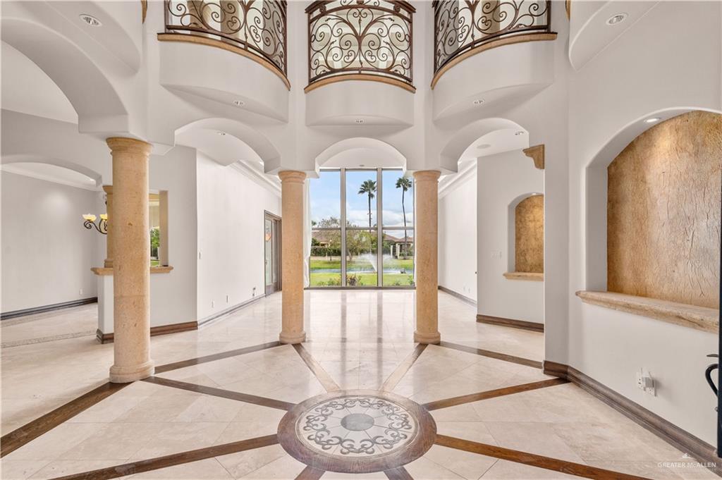 4405 South "H" Street McAllen, TX 78503 - Photo 3 of 33 a view of a hallway with wooden floor and a dining space