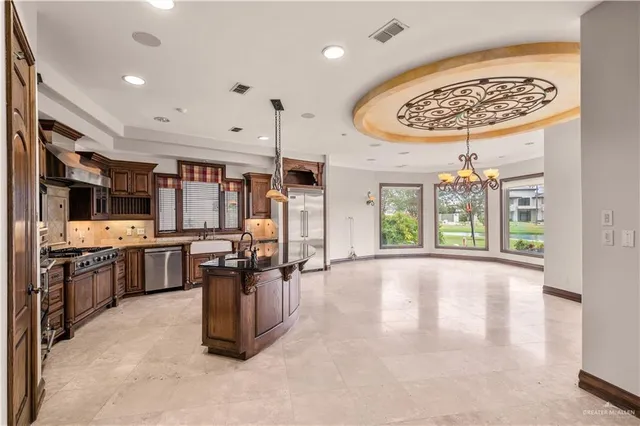 a view of a kitchen with lots of counter top space