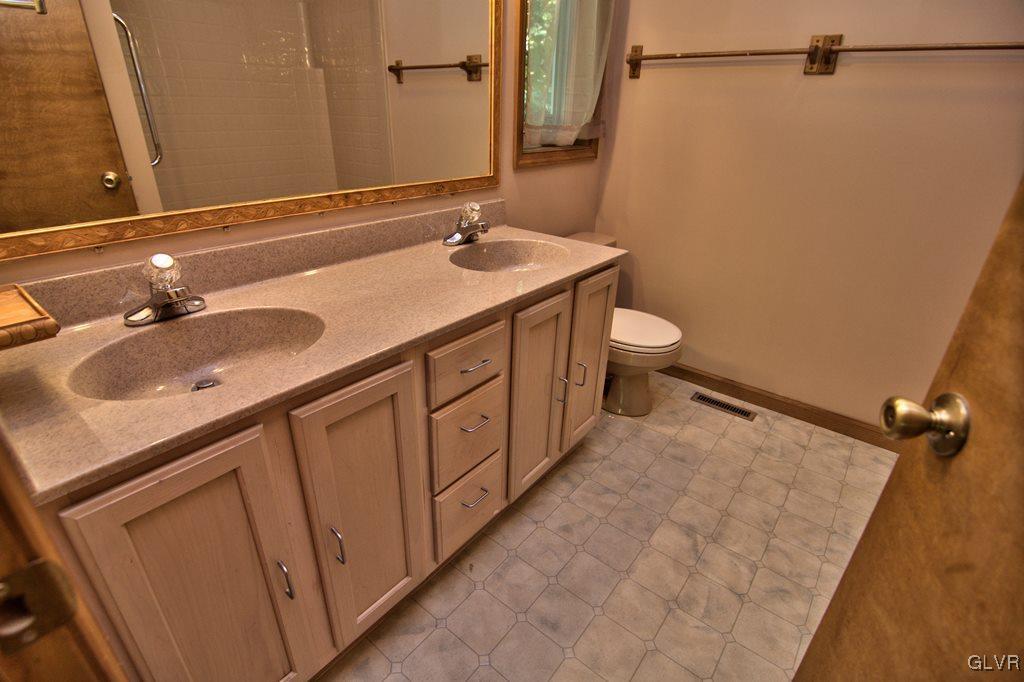 192 Chetco Road Albrightsville, PA 18210 - Photo 19 of 46 The Master bath has a vinyl floor, double sinks wi