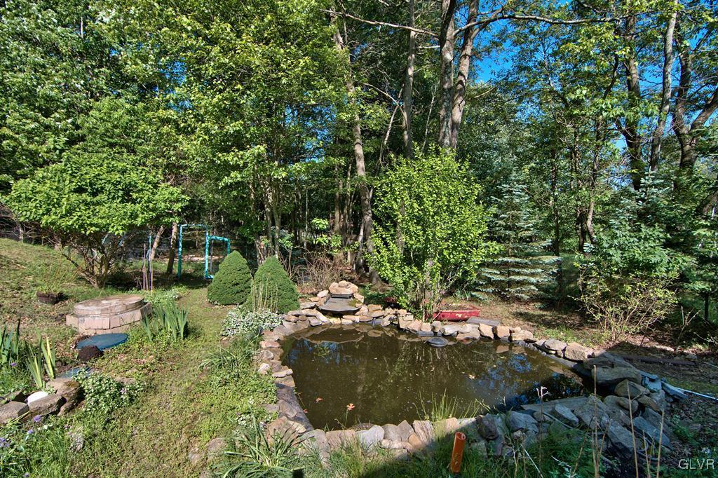 192 Chetco Road Albrightsville, PA 18210 - Photo 37 of 46 View of the pond and yard from the patio.
