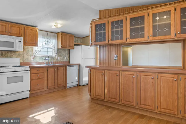 a kitchen with cabinets and stainless steel appliances