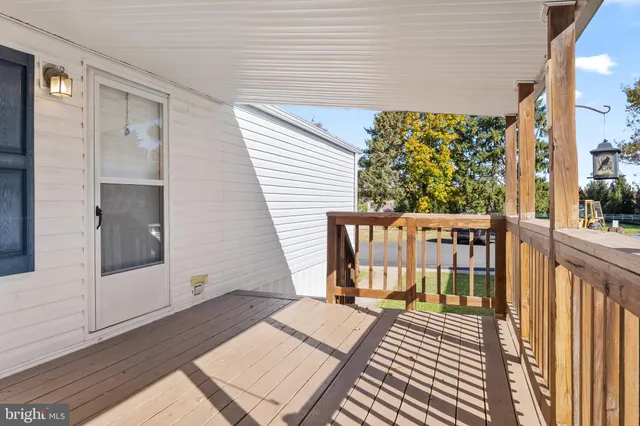 a view of a balcony with wooden floor