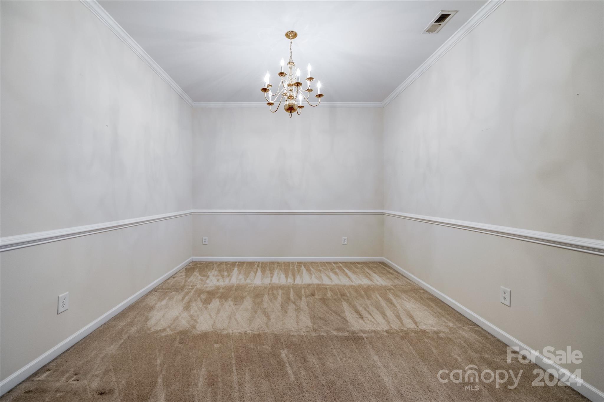 1671 Onyx Ridge Fort Mill, SC 29708 - Photo 7 of 38 a view of an empty room with a chandelier fan