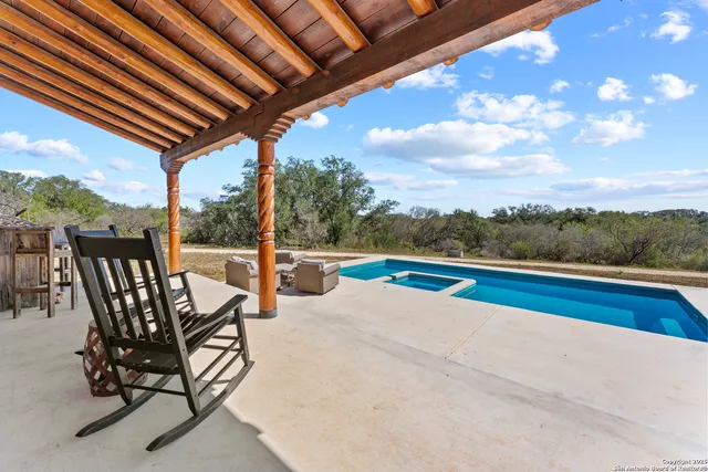a view of swimming pool with lounge chair