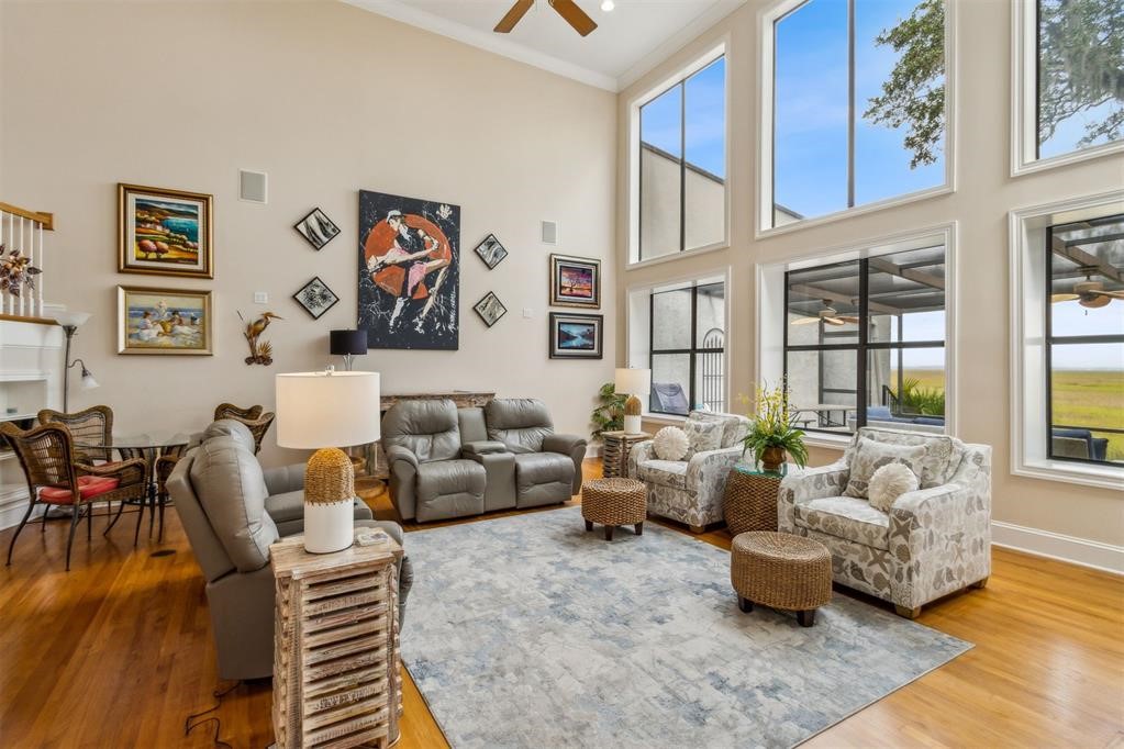 3119 Sea Marsh Road Fernandina Beach, FL 32034 - Photo 4 of 41 a living room with furniture or couch and a large window