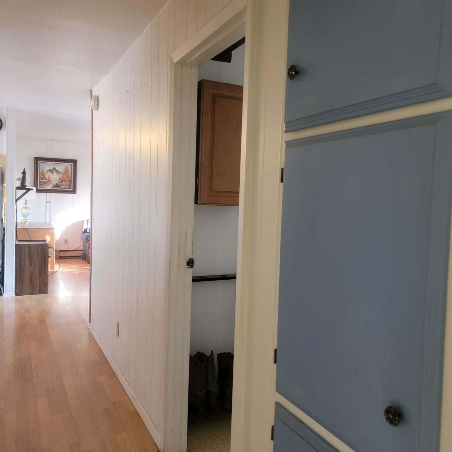 13021 Ridge View Drive Sutter Creek, CA 95685 - Photo 25 of 35 a view of a hallway with wooden floor and closet