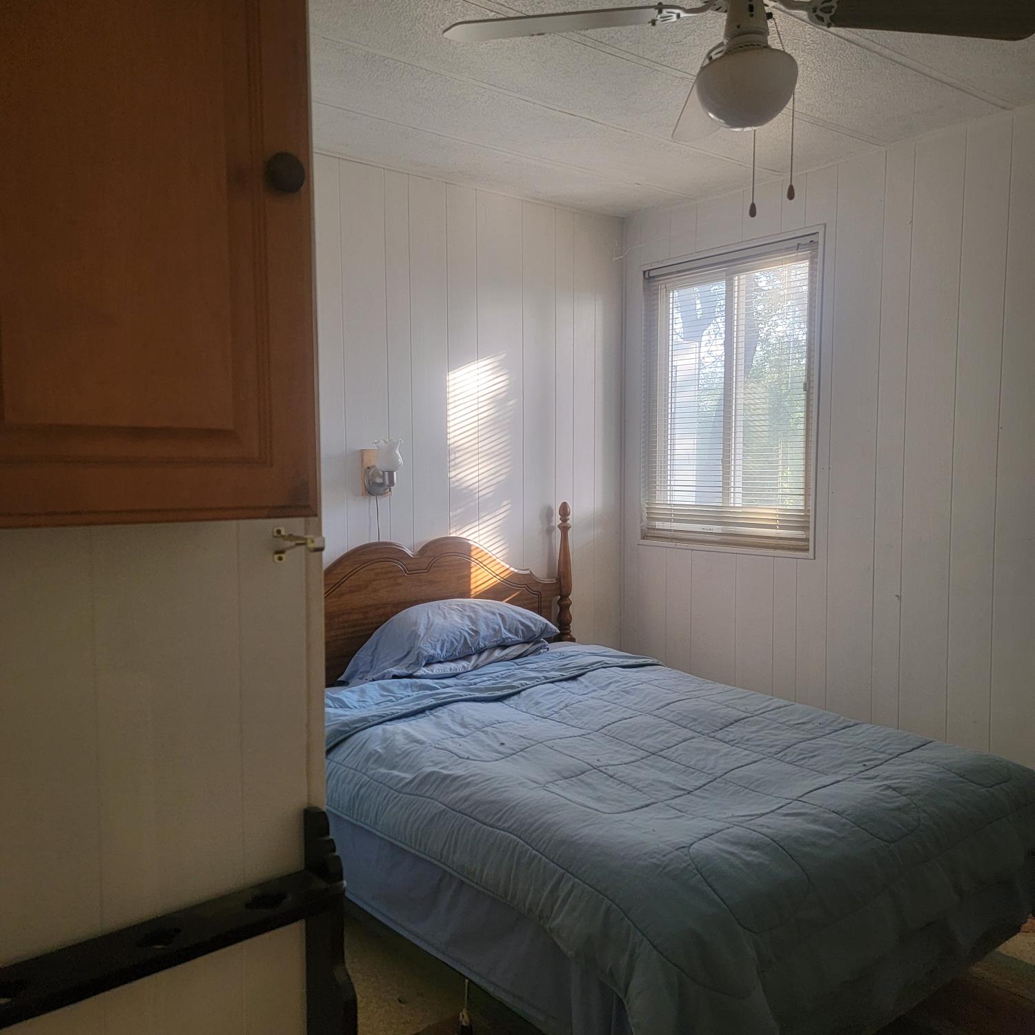 13021 Ridge View Drive Sutter Creek, CA 95685 - Photo 26 of 35 a bedroom with a bed and a window