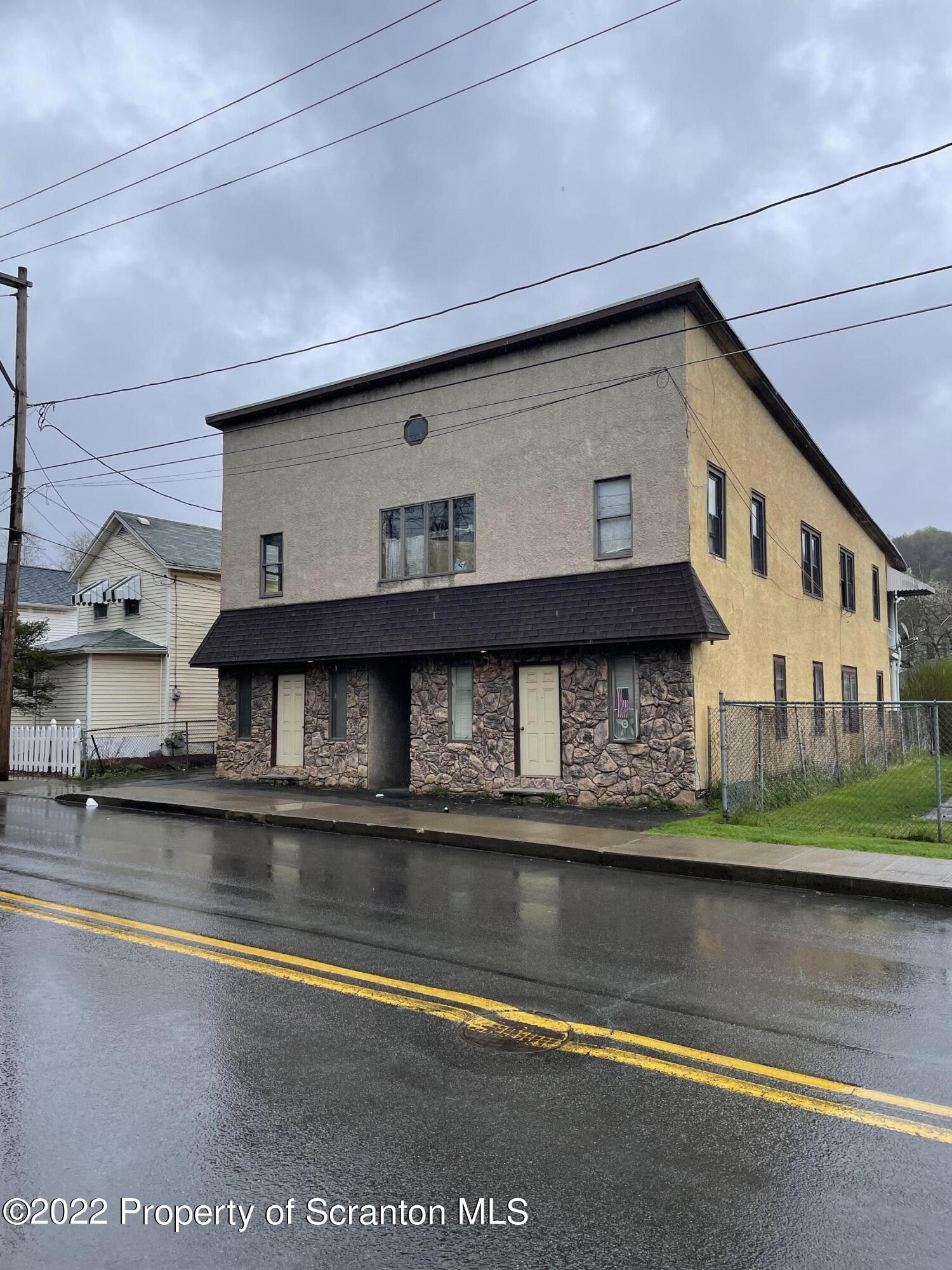 418 North Main Street Simpson, PA 18407 - Photo 1 of 19 a view of pool with building and lake view