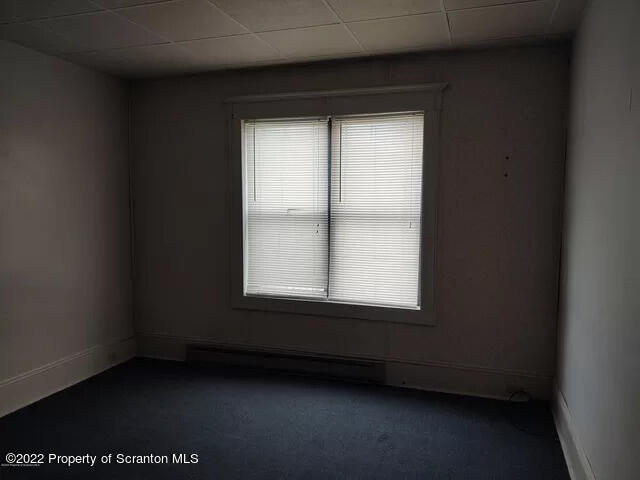 418 North Main Street Simpson, PA 18407 - Photo 11 of 19 a view of an empty room with a window