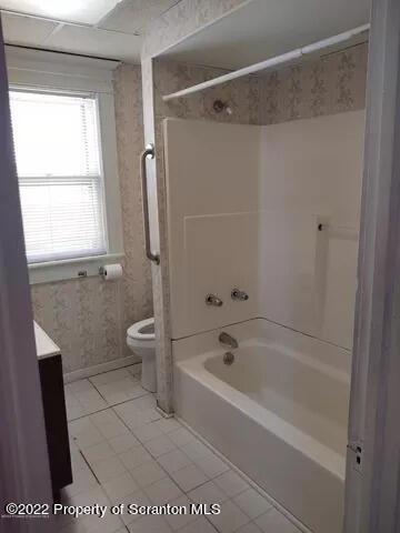 418 North Main Street Simpson, PA 18407 - Photo 12 of 19 a bathroom with a bathtub a toilet and a shower